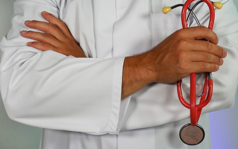 Doctor holding stethoscope